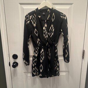 Chic and Sophisticated: Black Long Sleeve Romper with Beige Chevron Diamond Patt